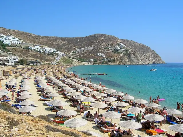 Elia Beach in Mykonos, featuring a sandy shoreline with calm water conditions