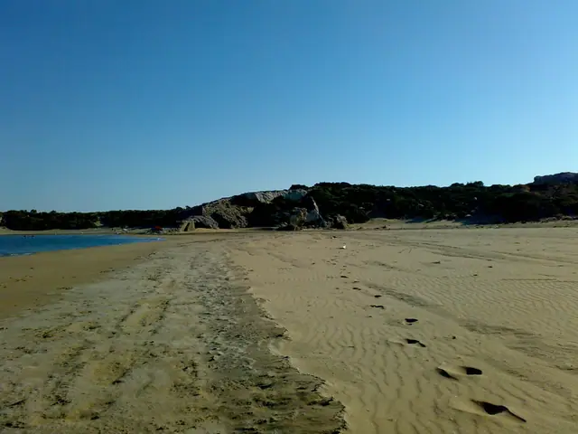 Mavros Kavos beach in Rhodes, featuring a pebbly shoreline with moderate water conditions
