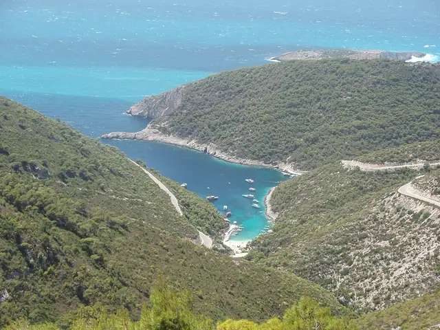 Porto Vromi Beach in Zakynthos, featuring a sandy shoreline with calm water conditions