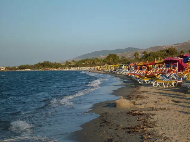 Flamingo Beach in Kos, featuring a sandy shoreline with moderate water conditions