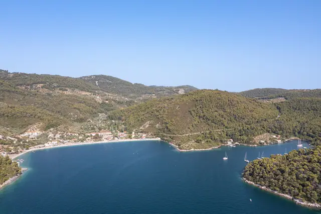 Panormos beach, Skopelos beach in Skopelos, featuring a sandy shoreline with moderate water conditions