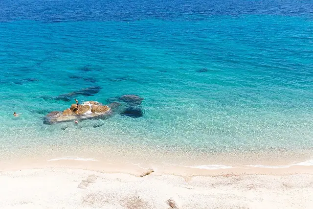 Fava Beach in Chalkidiki, featuring a mixed shoreline with moderate water conditions