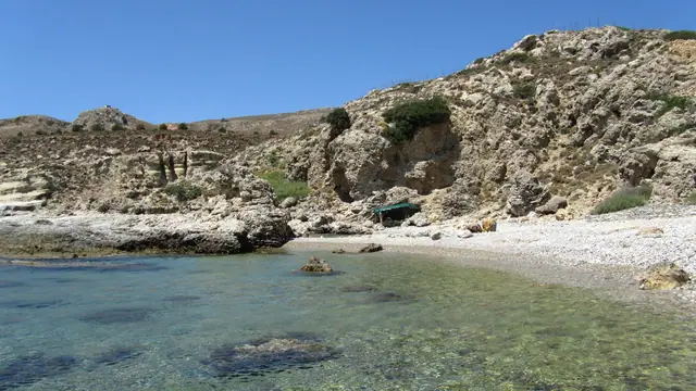 Grande Blue Beach in Rhodes, featuring a mixed shoreline with moderate water conditions