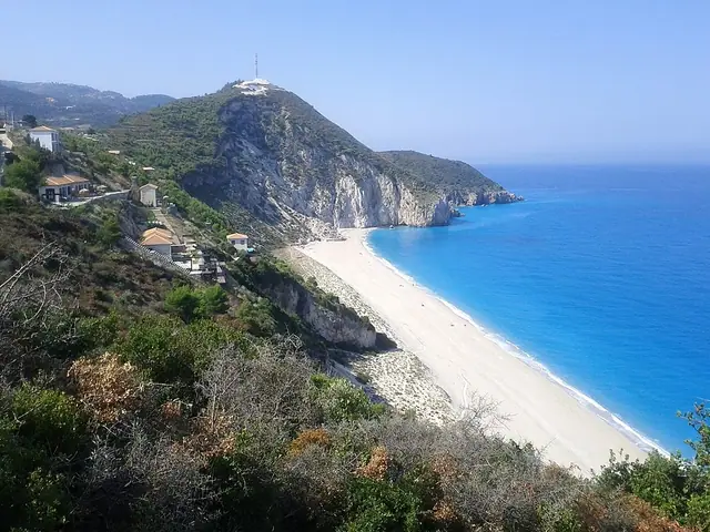 Mylos Beach in Lefkada, featuring a mixed shoreline with wavy water conditions