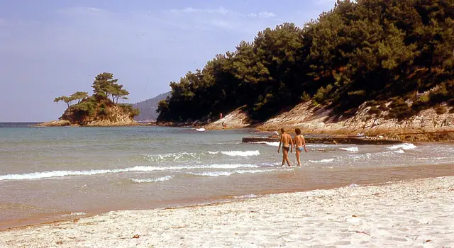 Makriammos beach in Thassos, featuring a sandy shoreline with moderate water conditions