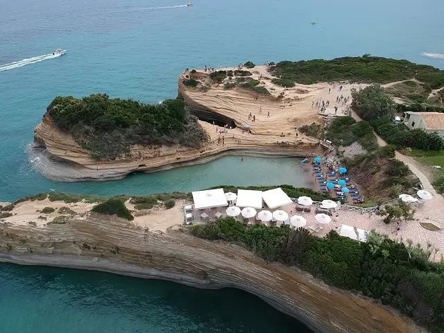 Canal d'Amour beach in Corfu, featuring a mixed shoreline with calm water conditions