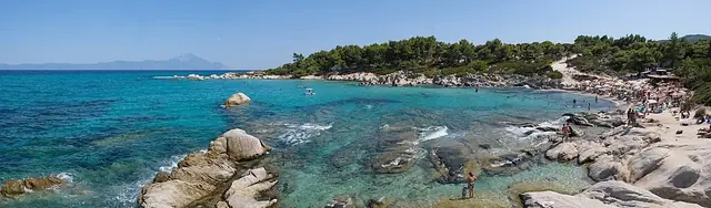 Kavourotrypes Beach in Chalkidiki, featuring a mixed shoreline with calm water conditions