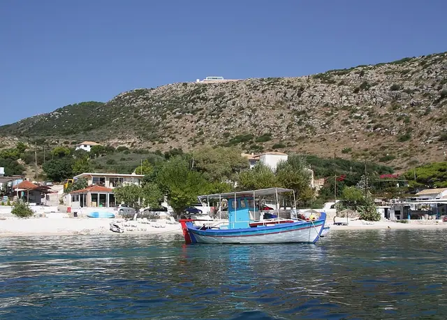 Agios Nikolaos Beach in Zakynthos, featuring a mixed shoreline with moderate water conditions