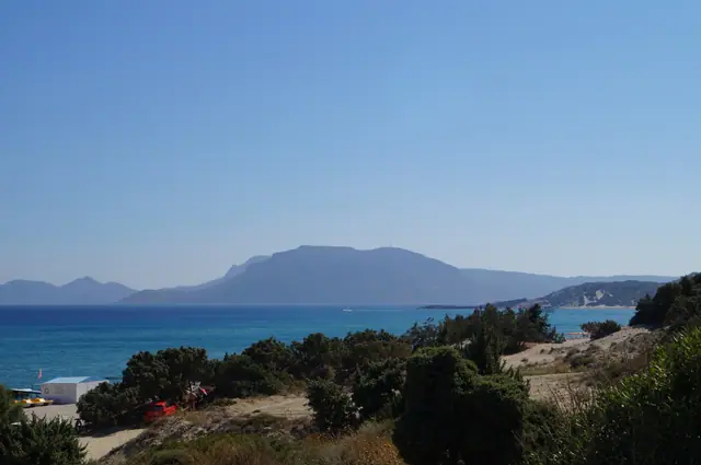 Polemi beach in Kos, featuring a mixed shoreline with moderate water conditions