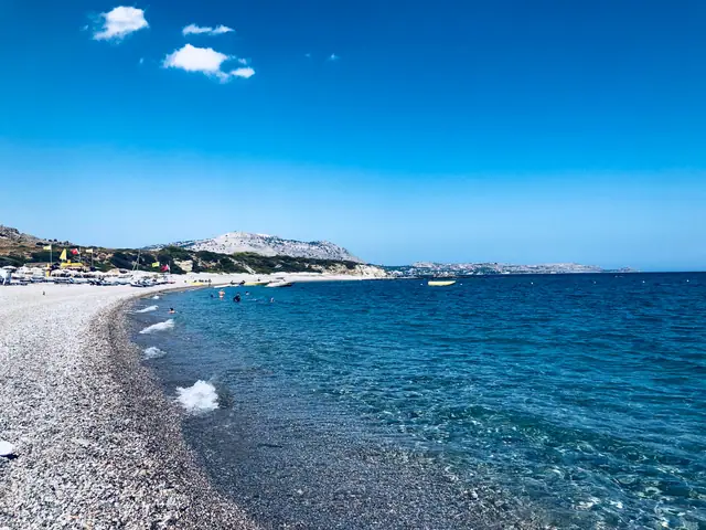 Kardamis Beach in Rhodes, featuring a mixed shoreline with moderate water conditions