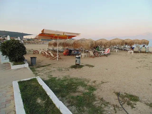 Sarti Beach in Chalkidiki, featuring a sandy shoreline with calm water conditions, certified with Blue Flag status for environmental quality
