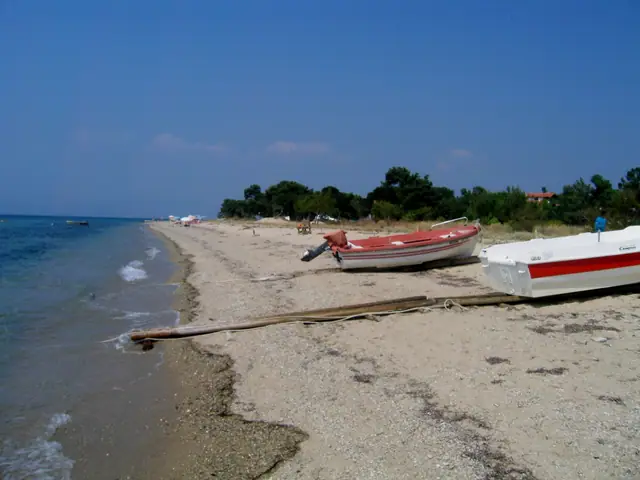 Skala Prinou beach in Thassos, featuring a sandy shoreline with moderate water conditions