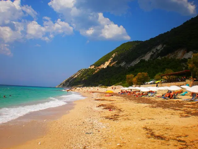 Pefkoulia Beach in Lefkada, featuring a mixed shoreline with wavy water conditions