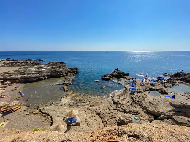 Oasis Beach in Rhodes, featuring a pebbly shoreline with moderate water conditions