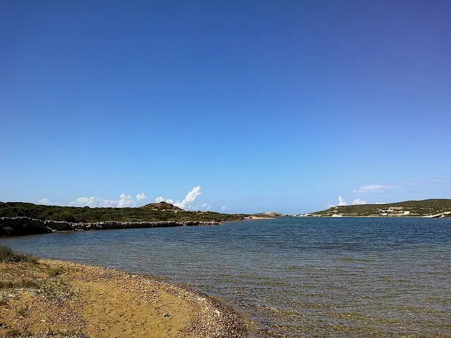 Lageri Beach in Paros, featuring a sandy shoreline with calm water conditions