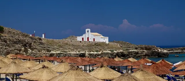 Saint Nicholas Beach in Zakynthos, featuring a sandy shoreline with calm water conditions