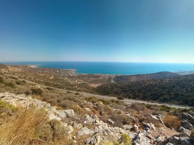 Stalida Beach in Crete, featuring a sandy shoreline with calm water conditions, certified with Blue Flag status for environmental quality