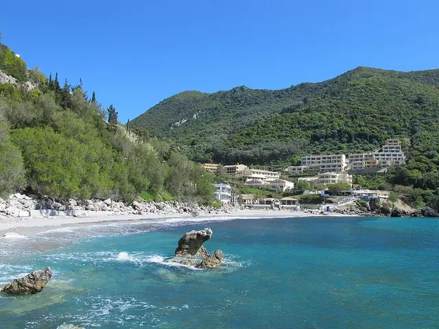 Ermones Beach in Corfu, featuring a mixed shoreline with moderate water conditions