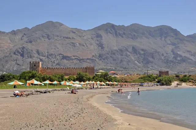Frangokastello Beach in Crete, featuring a sandy shoreline with calm water conditions