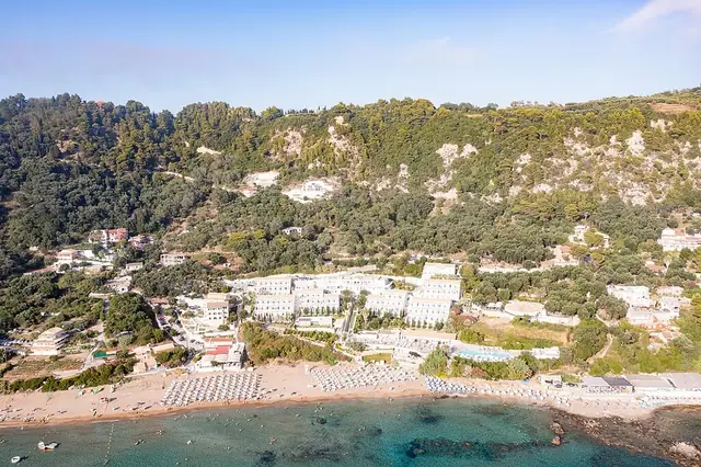 Kontogialos Beach in Corfu, featuring a sandy shoreline with moderate water conditions