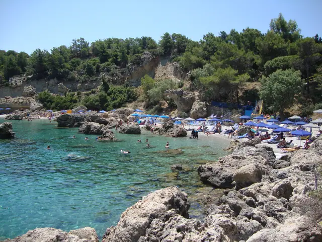 Anthony Quinn Beach in Rhodes, featuring a mixed shoreline with moderate water conditions