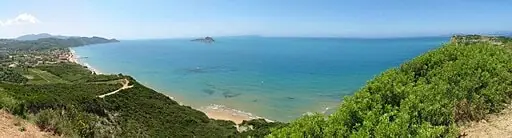 Arillas Beach in Corfu, featuring a sandy shoreline with calm water conditions