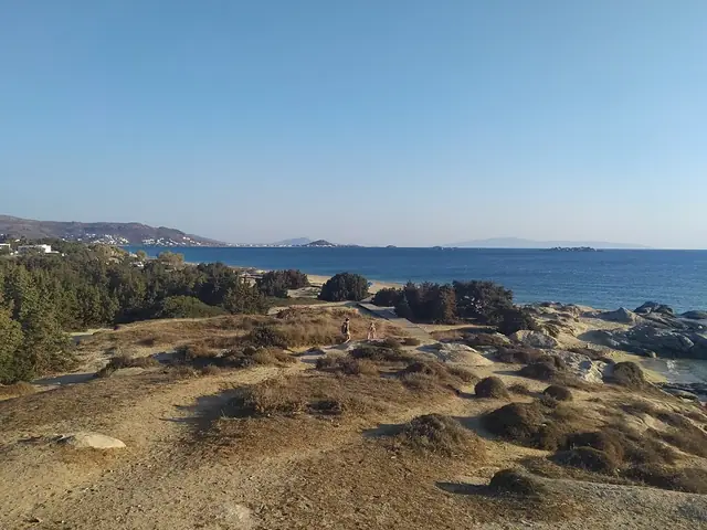 Maragkas Beach in Naxos, featuring a sandy shoreline with moderate water conditions