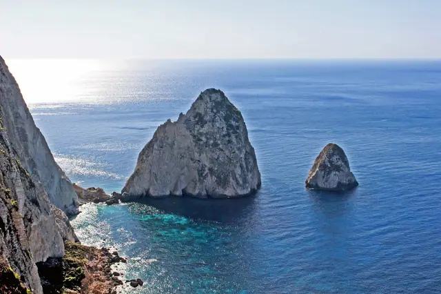 Mizithres Beach in Zakynthos, featuring a sandy shoreline with moderate water conditions