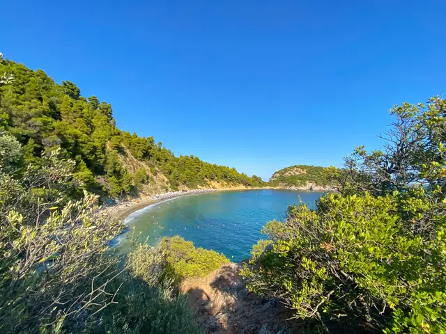Stafylos beach in Skopelos, featuring a mixed shoreline with moderate water conditions