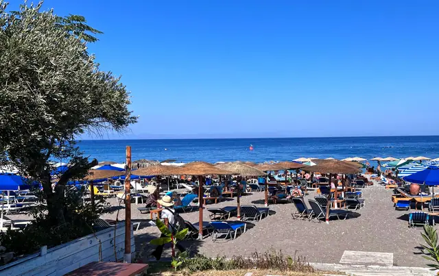 Paralia Elli beach in Rhodes, featuring a pebbly shoreline with moderate water conditions
