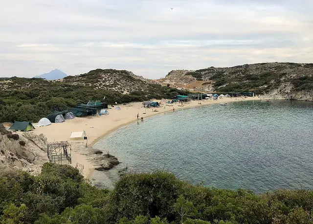 Kalamitsi Beach in Chalkidiki, featuring a sandy shoreline with calm water conditions