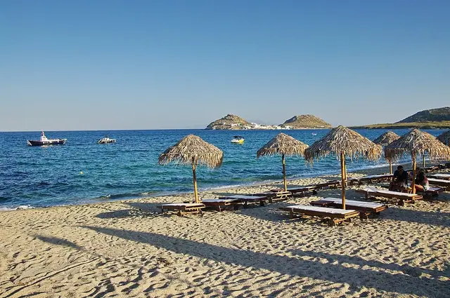 Kalafatis Beach in Mykonos, featuring a mixed shoreline with moderate water conditions