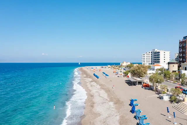 Windy Beach in Rhodes, featuring a pebbly shoreline with moderate water conditions