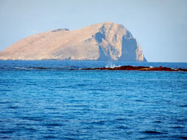Gramvousa Beach in Crete, featuring a sandy shoreline with moderate water conditions