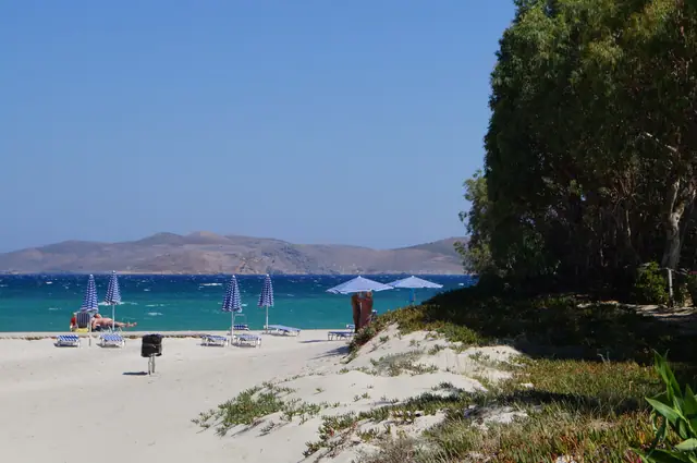 Marmari Beach in Kos, featuring a sandy shoreline with calm water conditions