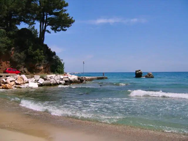 Chrysi Ammoudia beach in Thassos, featuring a sandy shoreline with moderate water conditions