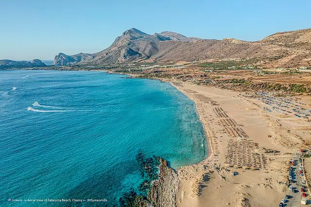 Falasarna Beach in Crete, featuring a sandy shoreline with moderate water conditions