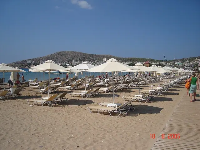 Varkiza Beach in Attica, featuring a mixed shoreline with calm water conditions, certified with Blue Flag status for environmental quality