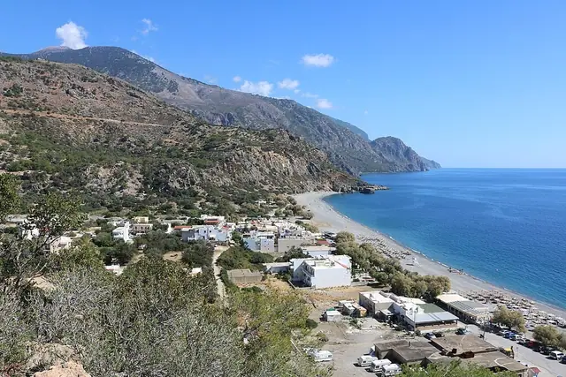 Sougia Beach in Crete, featuring a mixed shoreline with calm water conditions