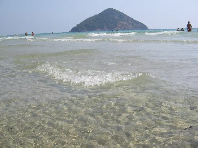 Paradise Beach in Thassos, featuring a sandy shoreline with moderate water conditions