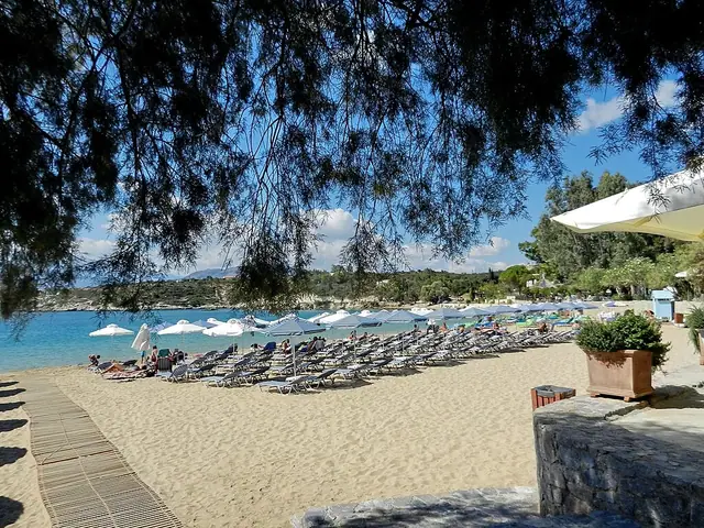 Marathi Beach in Crete, featuring a sandy shoreline with calm water conditions