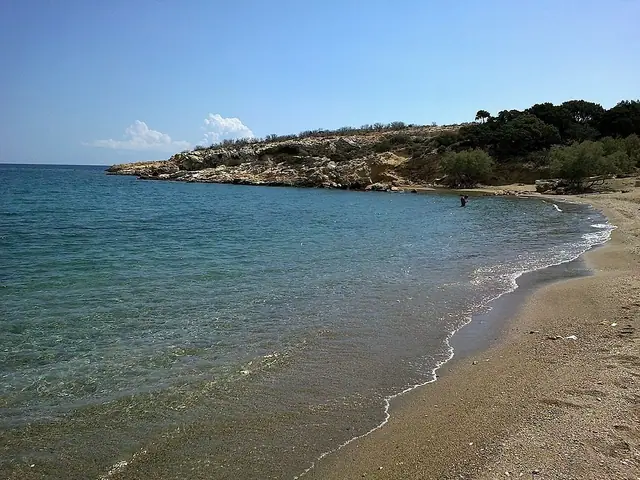 Tripiti Beach in Paros, featuring a mixed shoreline with calm water conditions
