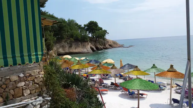 San Antonio beach in Thassos, featuring a sandy shoreline with moderate water conditions