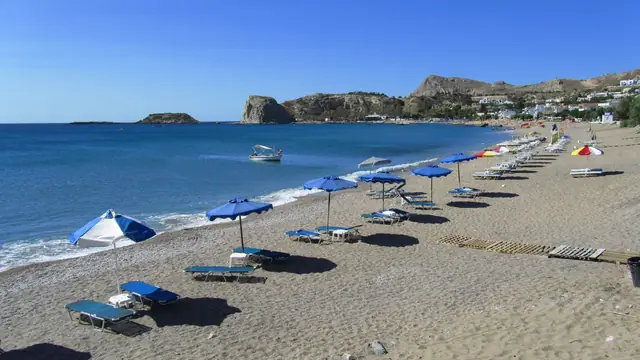 Stegna Beach in Rhodes, featuring a pebbly shoreline with moderate water conditions