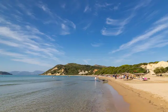 Gerakas Beach in Zakynthos, featuring a sandy shoreline with calm water conditions