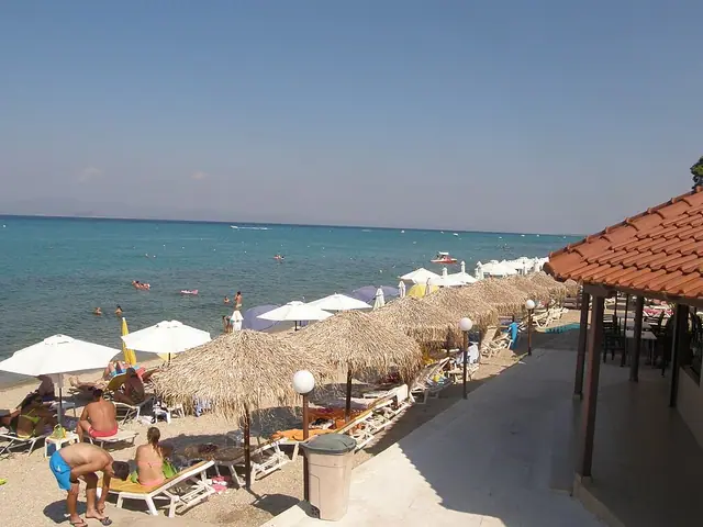 Hanioti Beach in Chalkidiki, featuring a mixed shoreline with calm water conditions, certified with Blue Flag status for environmental quality