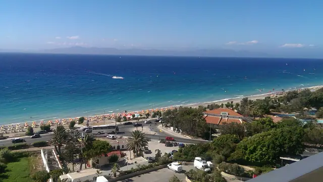 Ixia Beach in Rhodes, featuring a pebbly shoreline with moderate water conditions