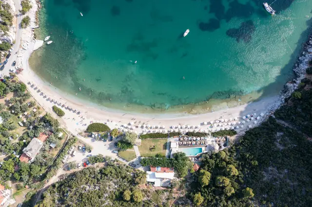 Limnonari beach in Skopelos, featuring a sandy shoreline with moderate water conditions
