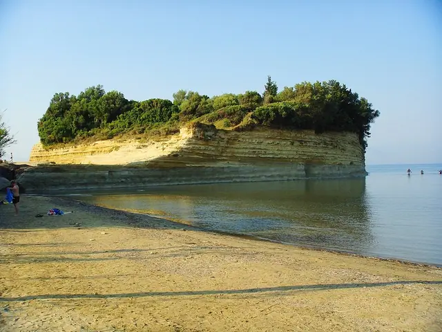 Sidari Beach in Corfu, featuring a sandy shoreline with calm water conditions