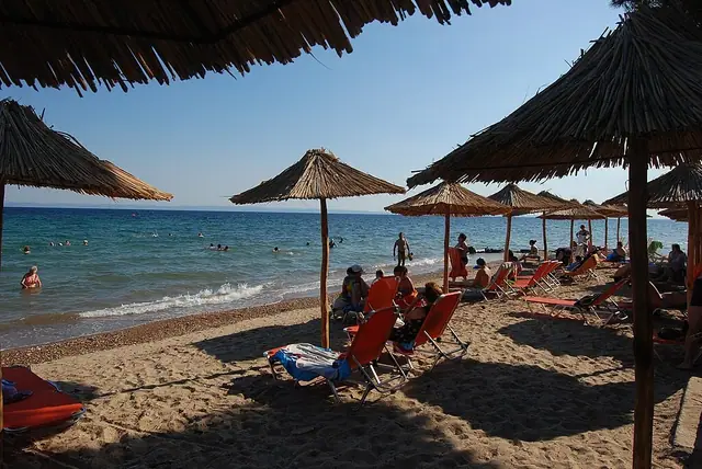 Metamorfosi Beach in Chalkidiki, featuring a sandy shoreline with calm water conditions, certified with Blue Flag status for environmental quality